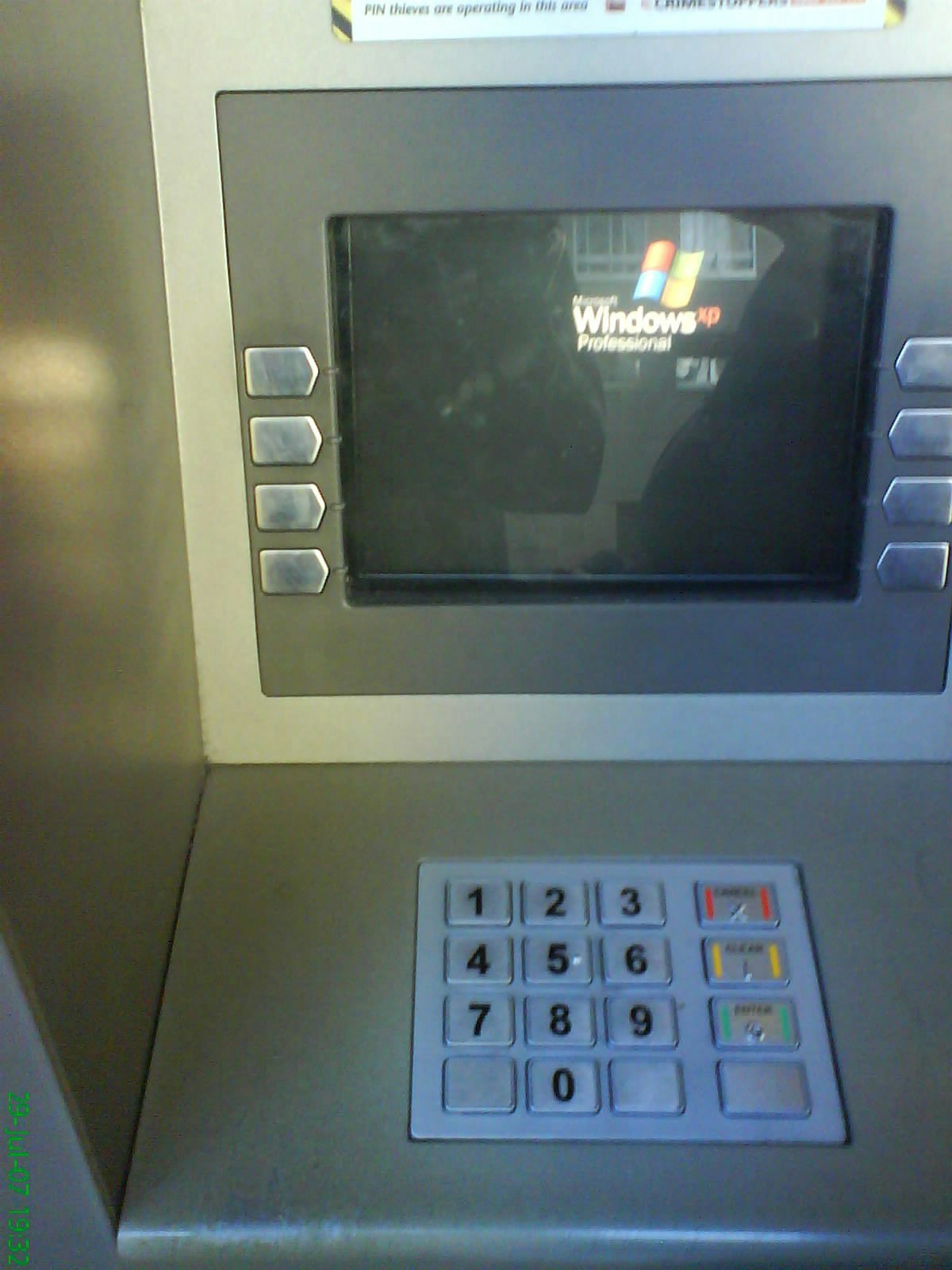 featured image - Do ATMs running Windows XP pose a security risk? You can bank on it!