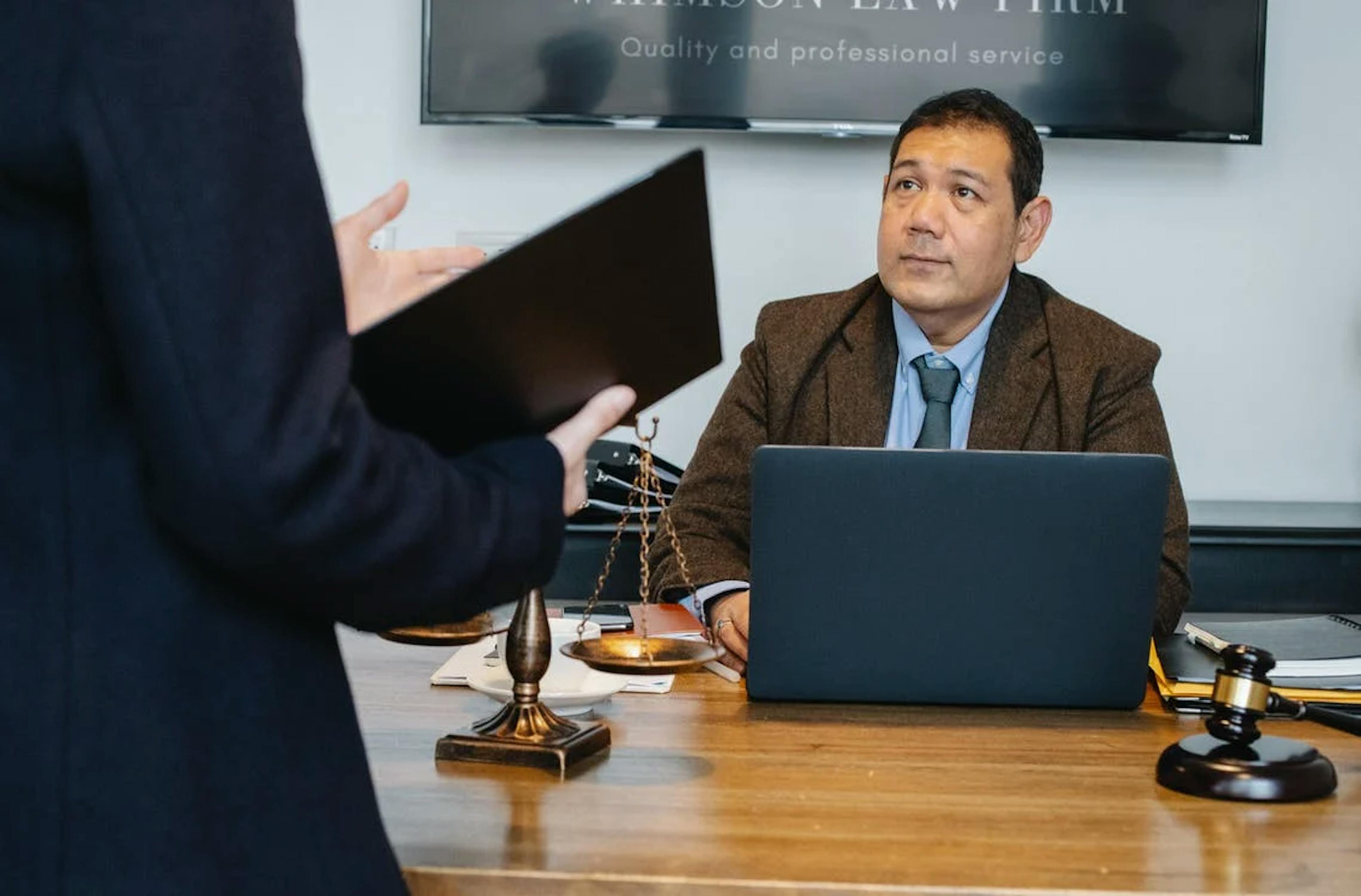 Photo by Sora Shimazaki: https://www.pexels.com/photo/serious-ethnic-lawyer-discussing-new-case-with-colleague-5668798/