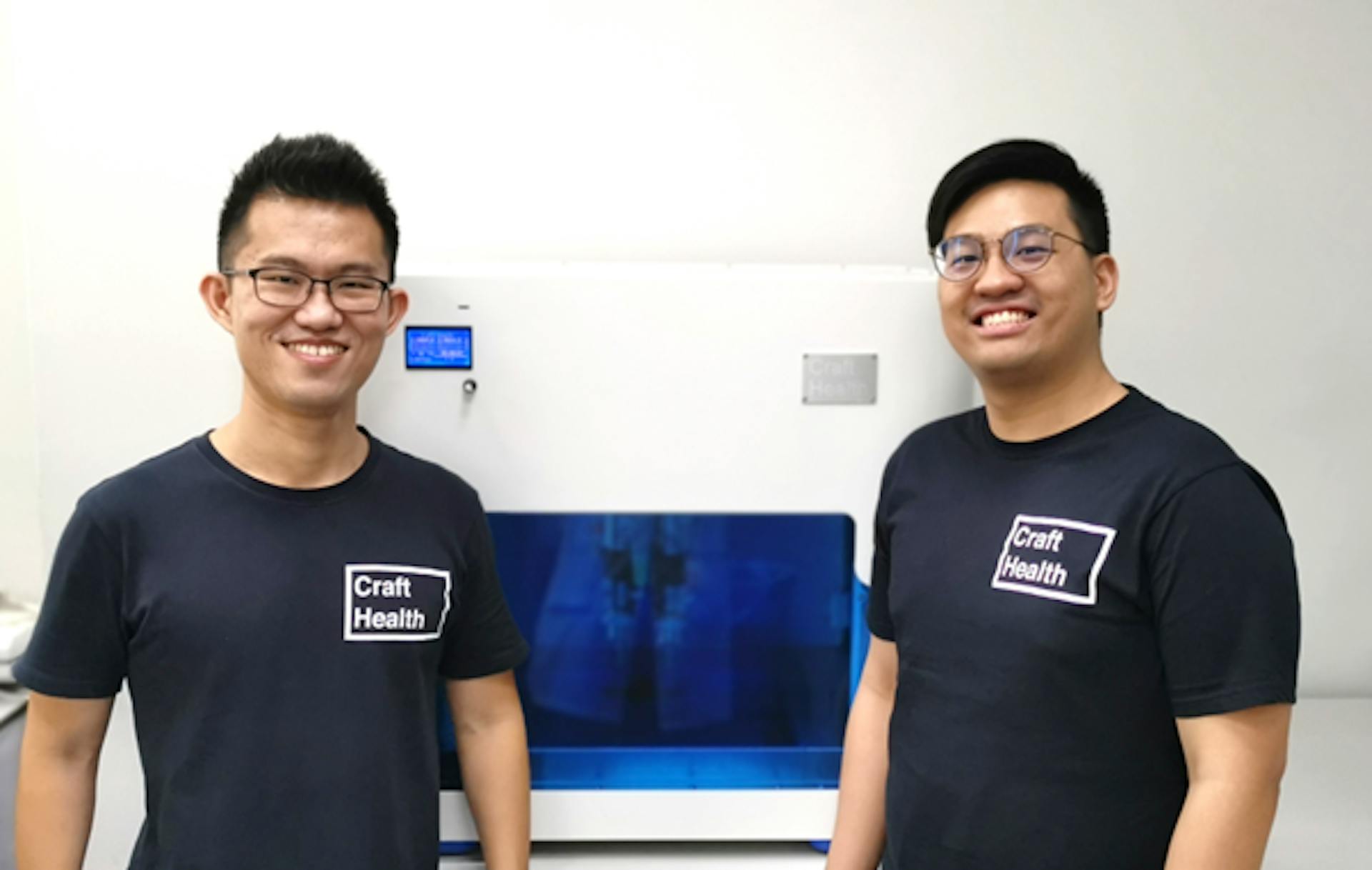 Craft Health Pte Ltd founders: Dr. Wei Jiang GOH (right) and Dr. Seng Han LIM (left) beside CraftMake™, one of the world's first 3D printers for pharmaceuticals that do not involve heat or UV curing