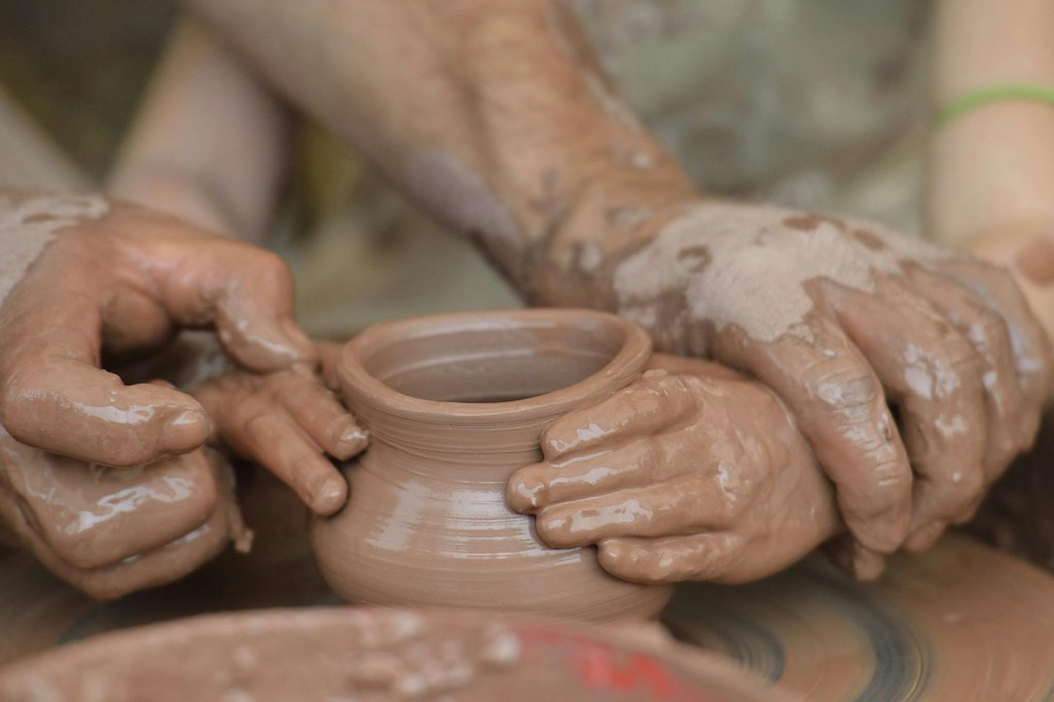 "Child's Hands in Clay" by diana_robinson is marked with CC BY-NC-ND 2.0.