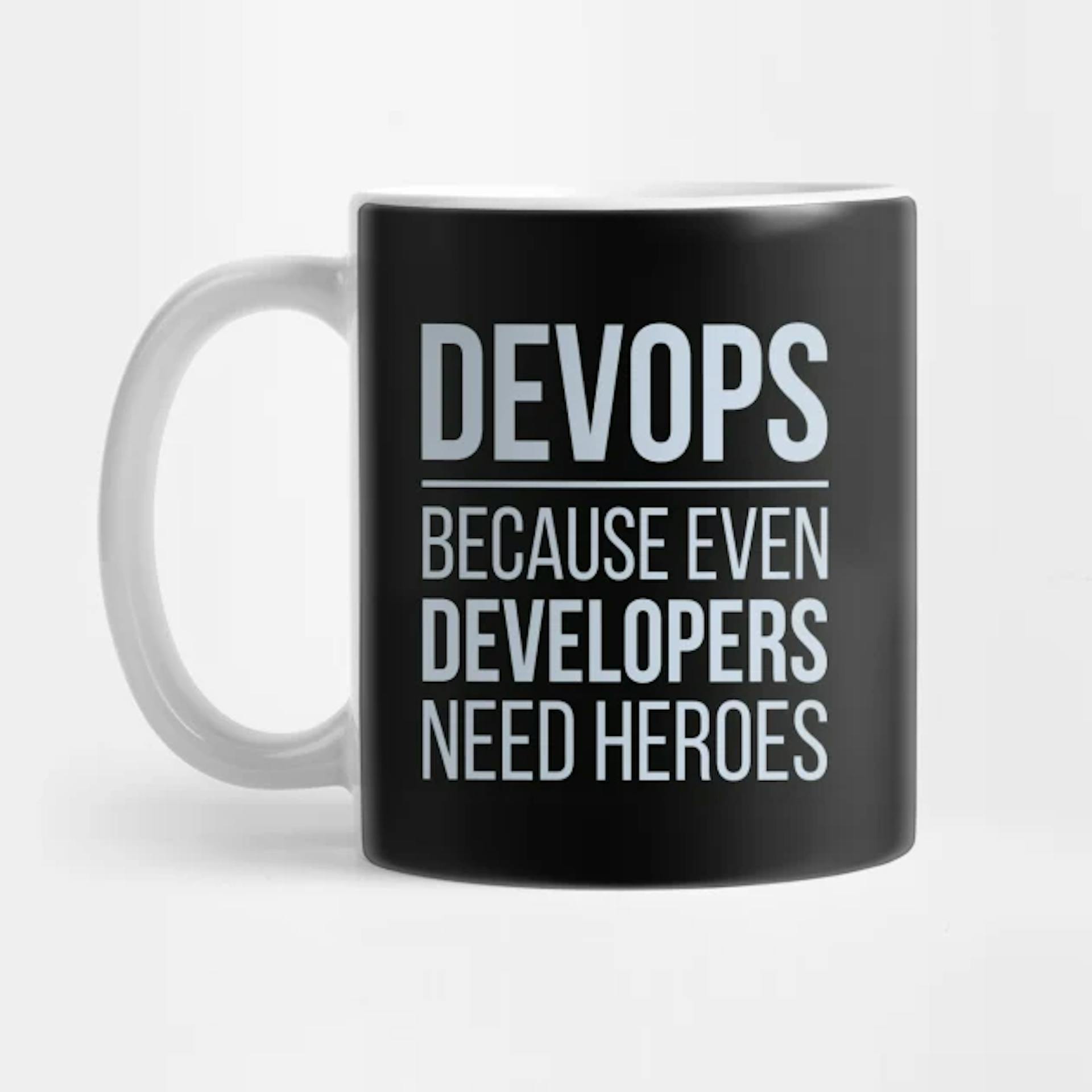 Photo Source: https://www.teepublic.com/mug/7864928-developer-devops-because-even-developers-need-hero