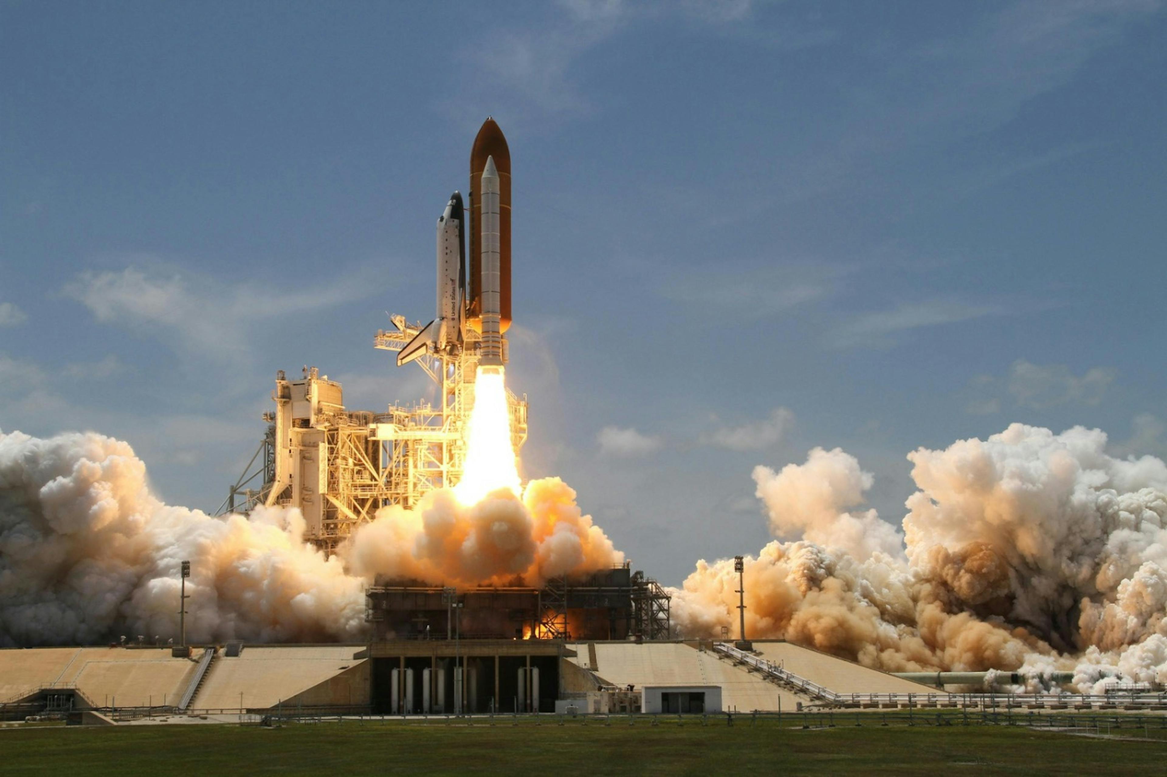 The space shuttle takes off.