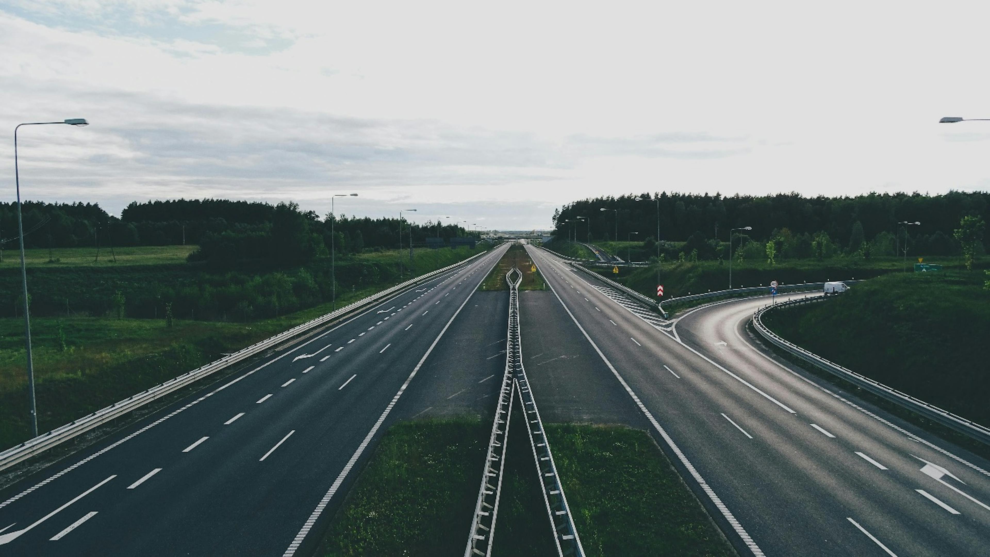 Four lines road going into the horizon.