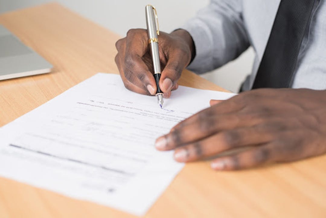 Source: https://www.pexels.com/photo/person-holding-gray-twist-pen-and-white-printer-paper-on-brown-wooden-table-955389/