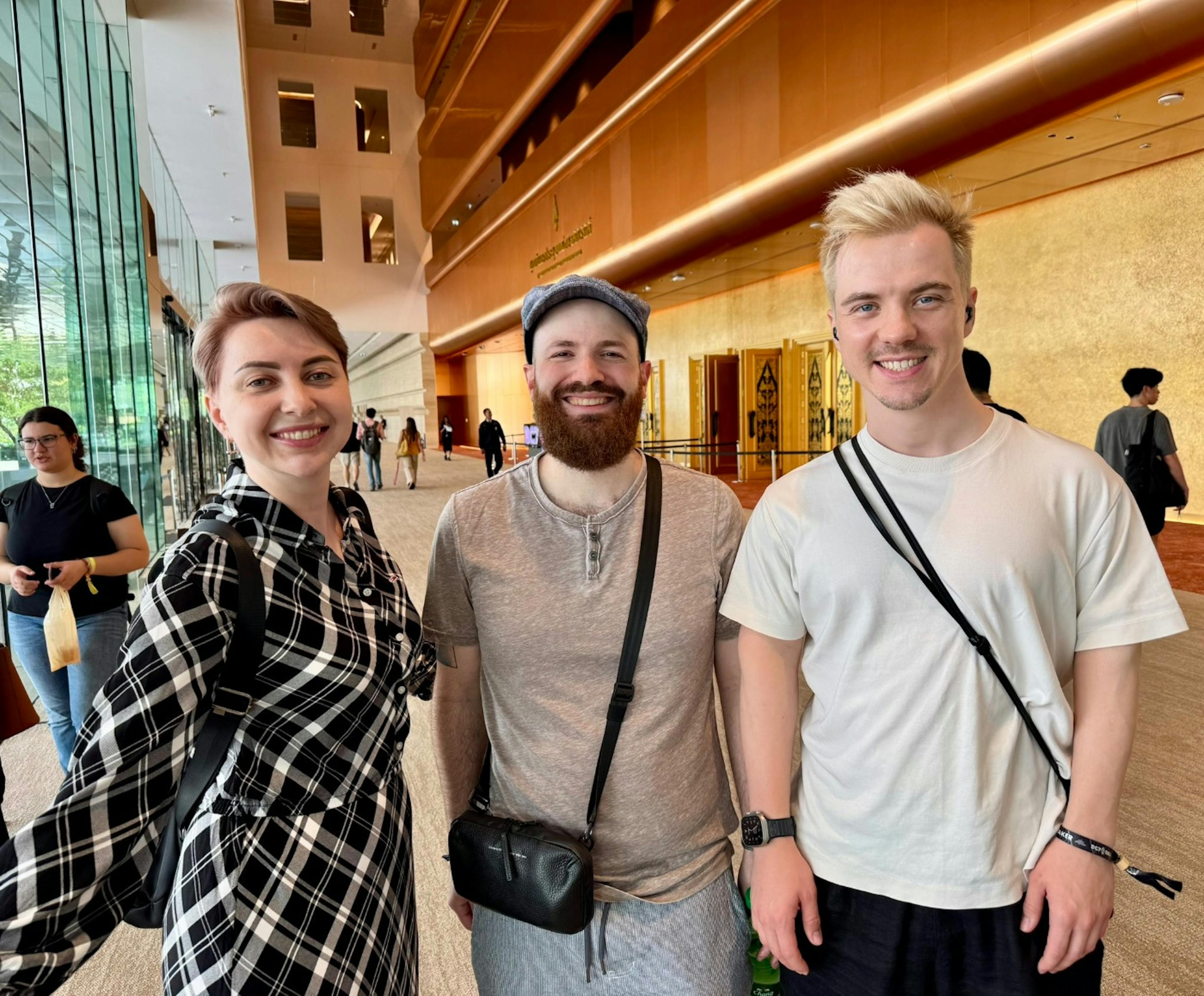 Me, sassal.eth, and my husband Andrii at the Devcon venue, Day 0