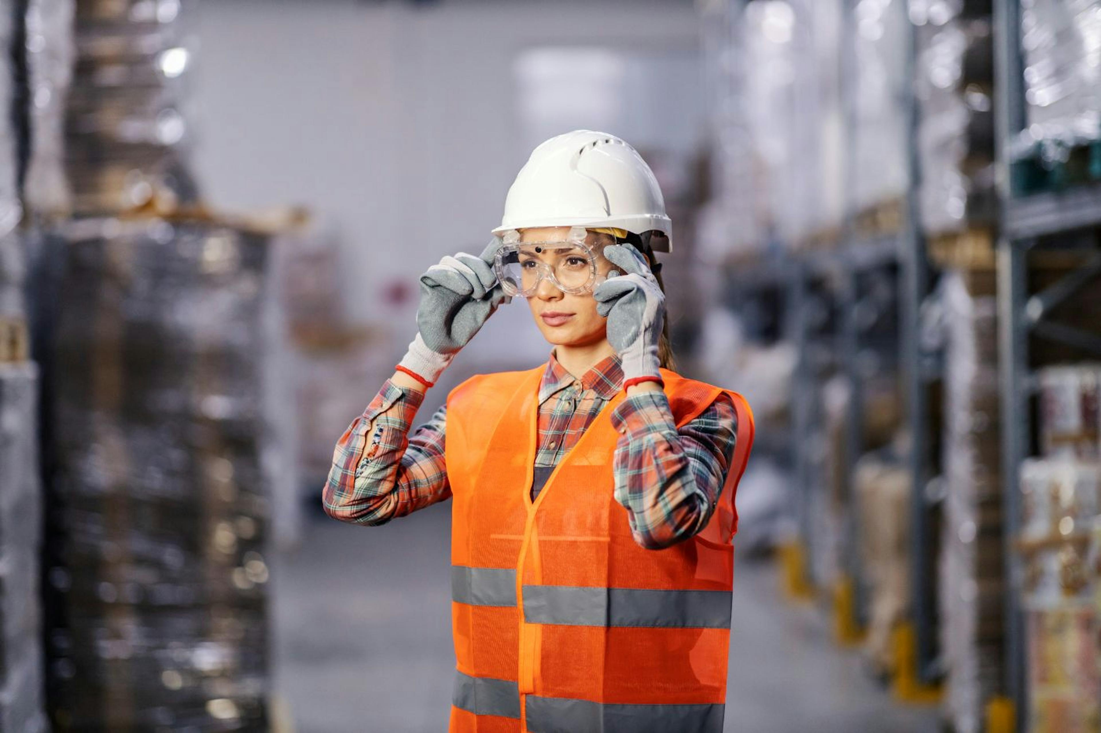 Warehouse worker using smart AR glasses for efficient logistics management