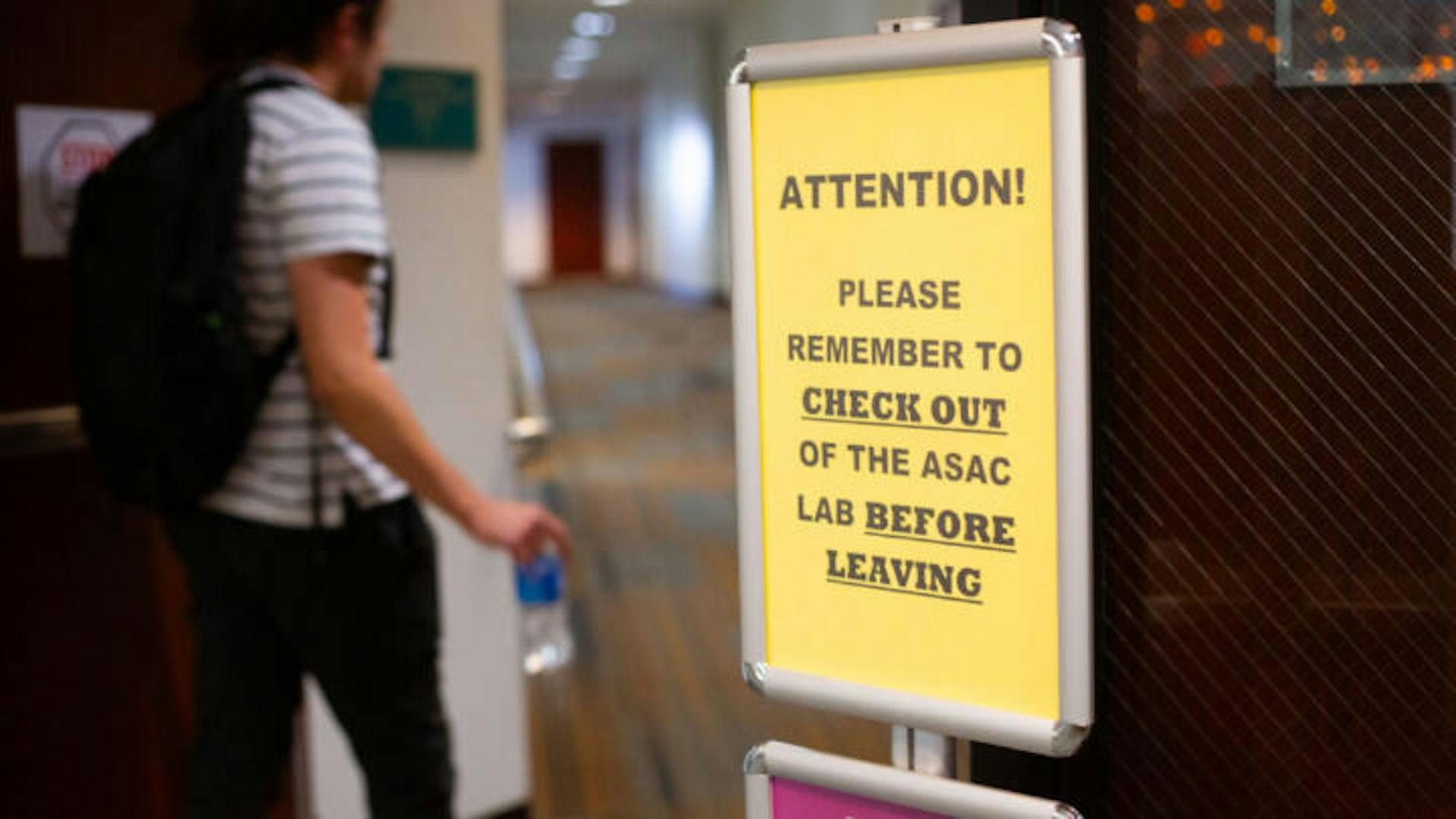 Closeup photo of a sign at a lab in Mt. San Antonio College that reminds students to check out of the lab before leaving