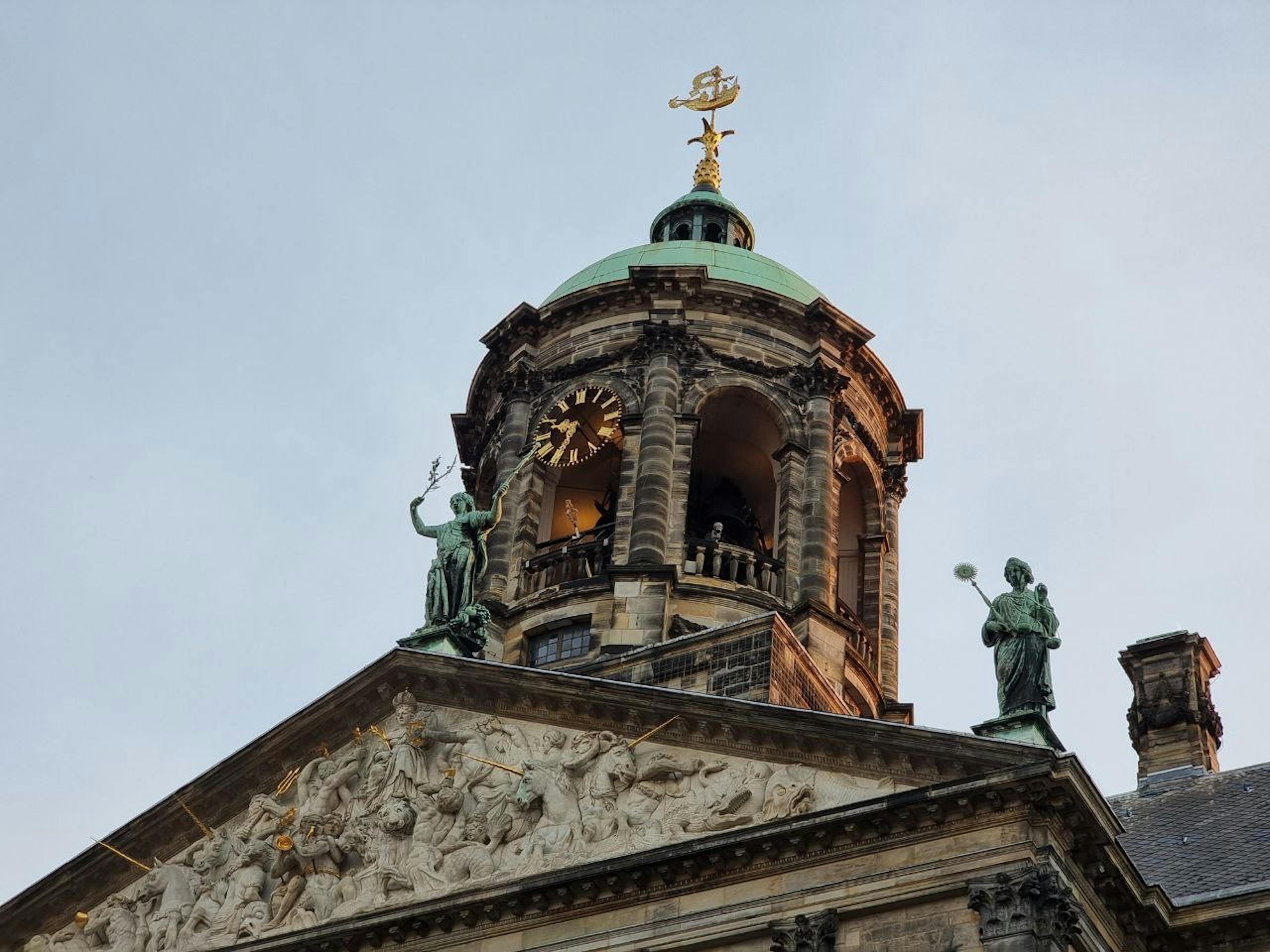 A golden ship on the dome of Amsterdam’s Dam Square Palace