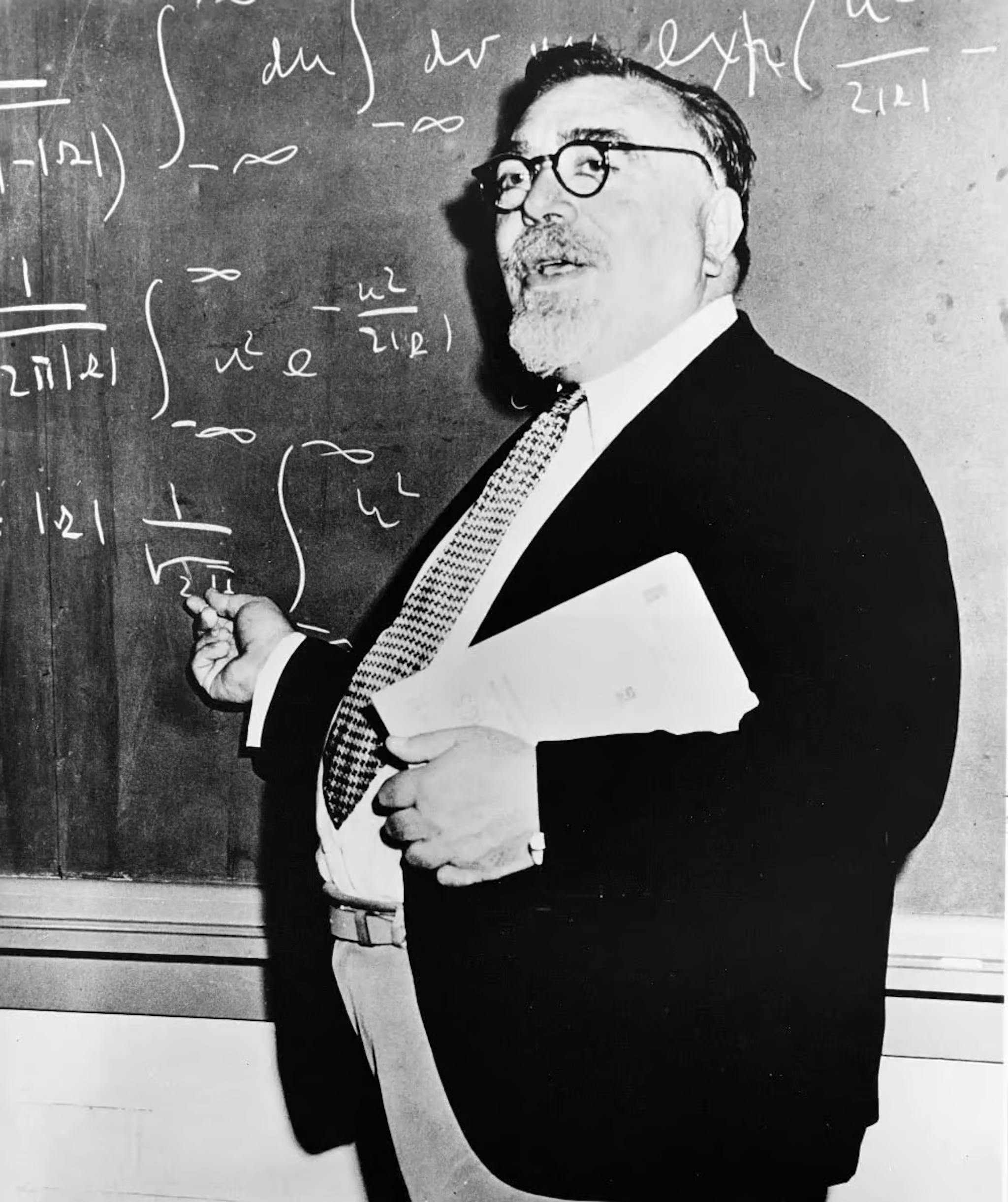 Norbert Wiener (1894-1964) made significant contributions to stochastic processes, electronic engineering, and control systems. He originated cybernetics and theorized that feedback mechanisms lead to intelligent behavior, laying the groundwork for modern AI.