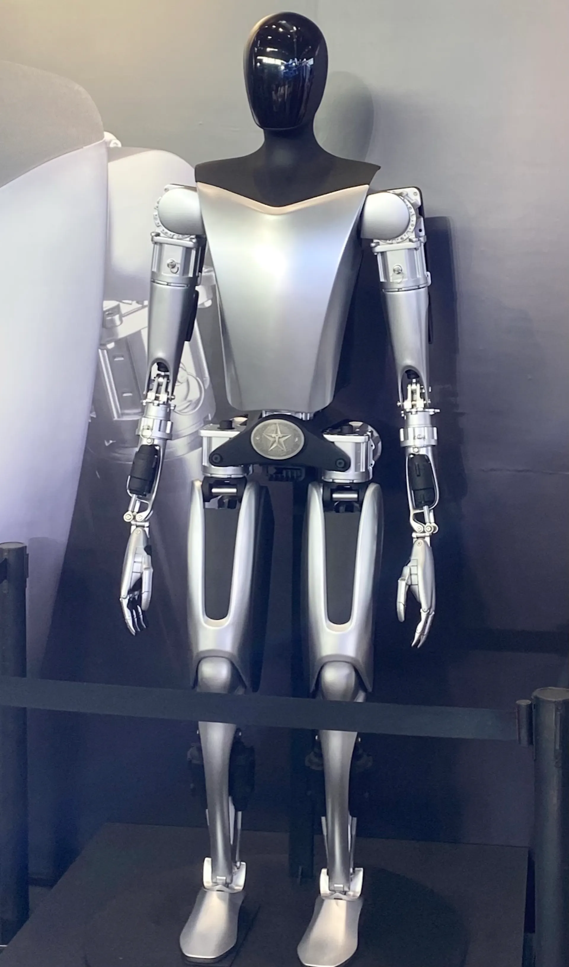 Tesla's Optimus humanoid on display. Impressive on a pedestal; still largely a research platform on the floor.