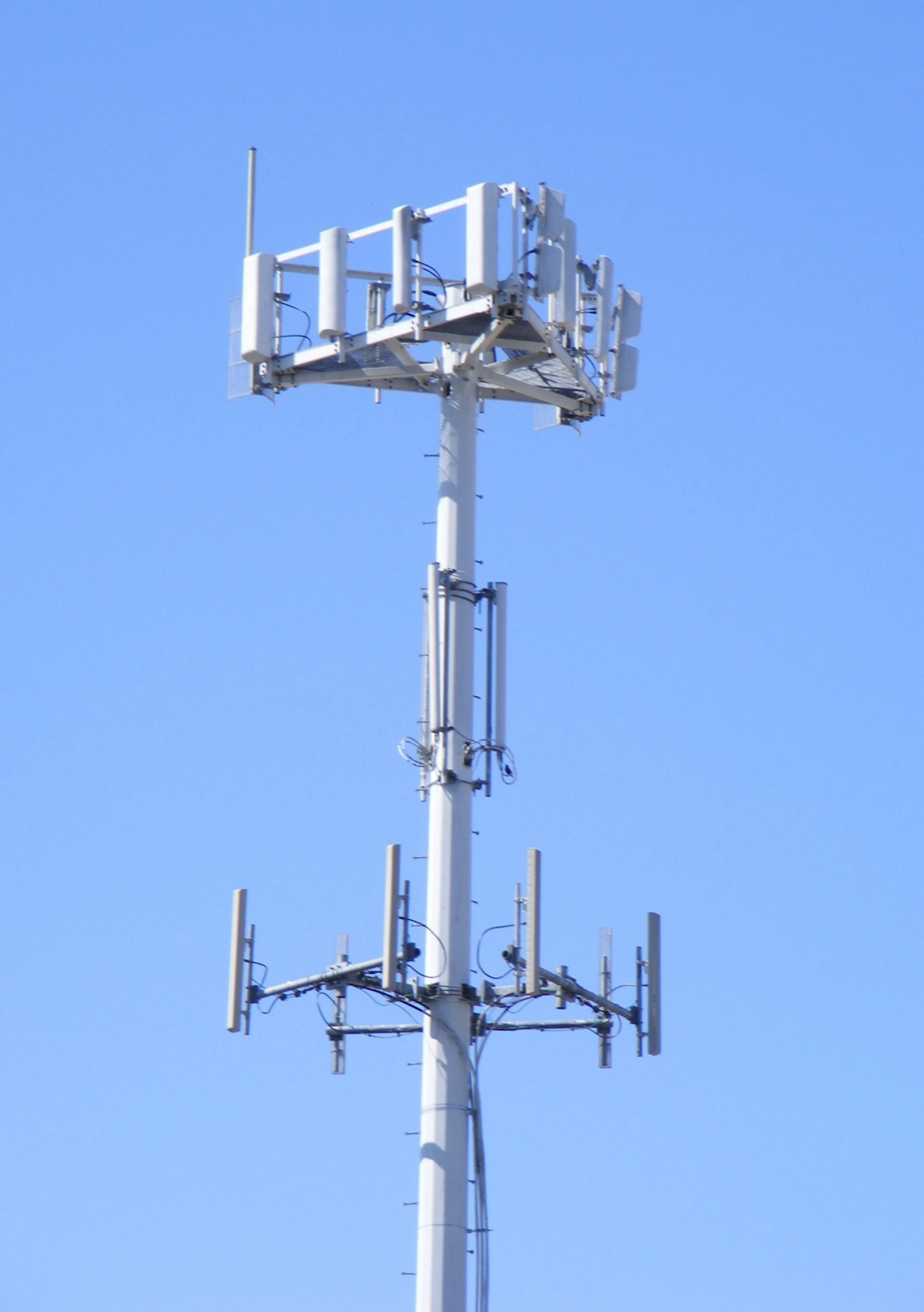 The tower is steel and antennas. Increasingly, the base station behind it is just software.