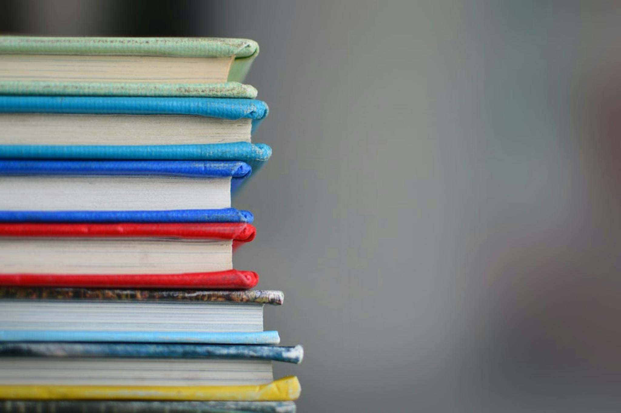 Shallow-focus photography of books