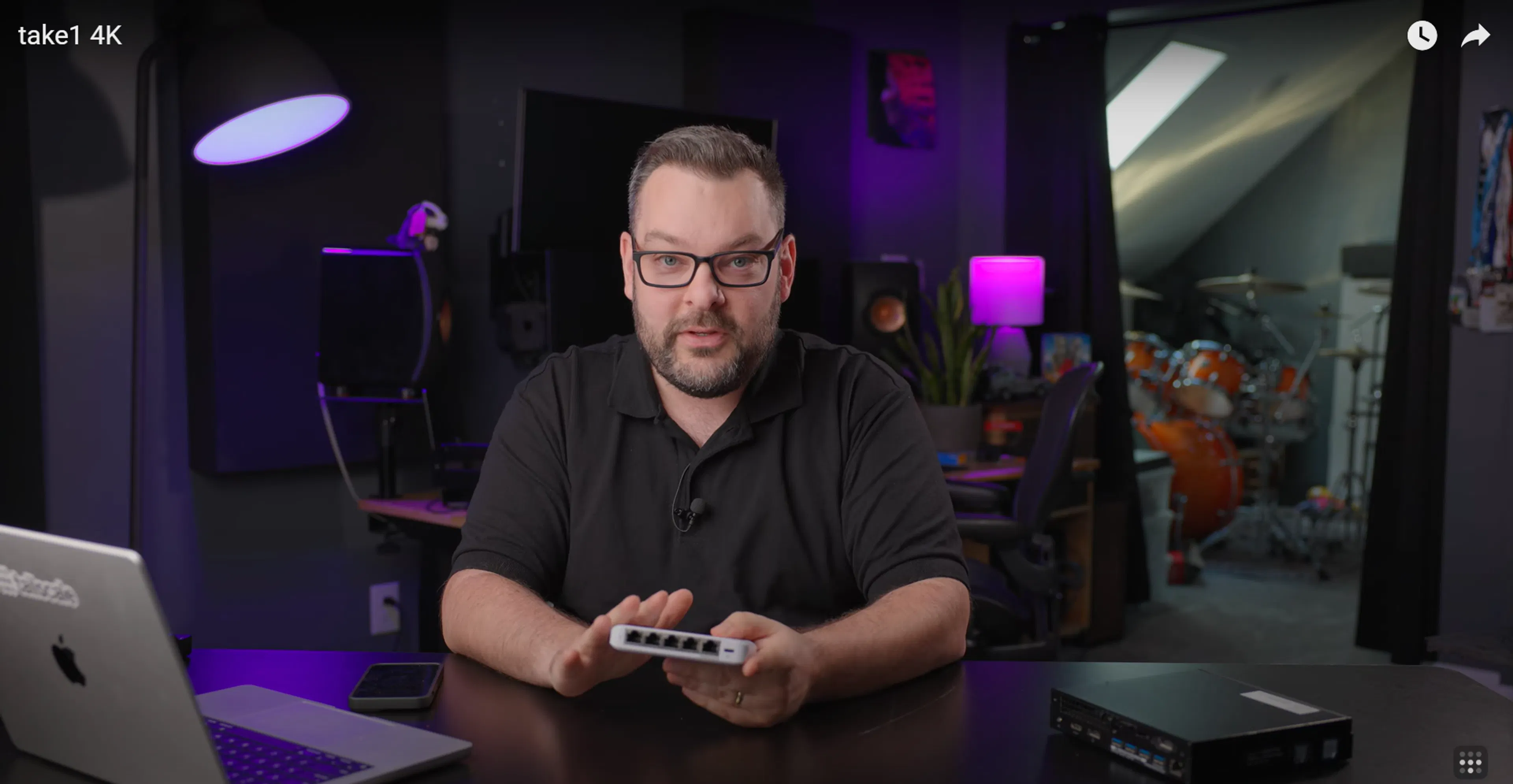 Alex holding a Ubiquiti switch