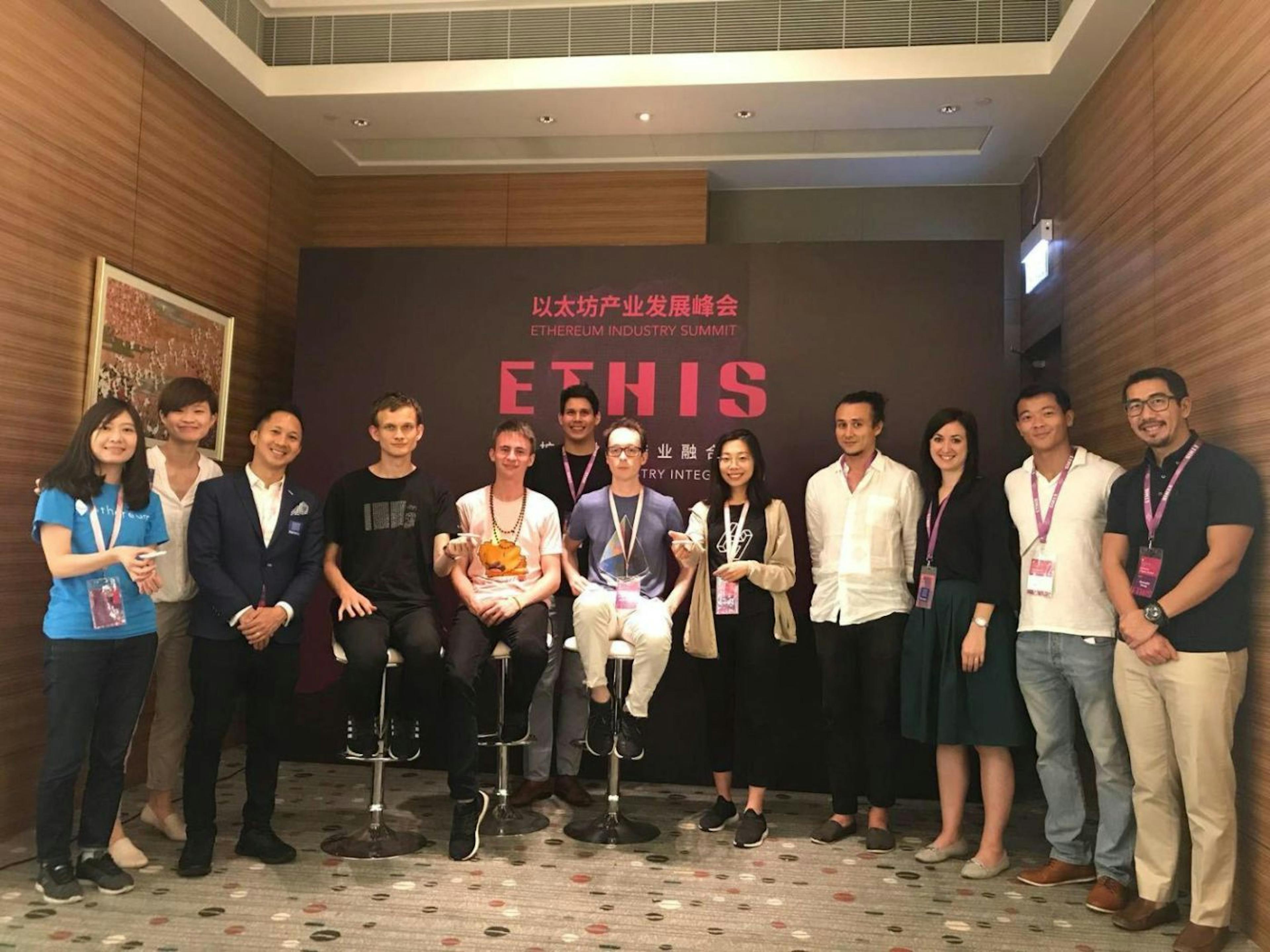 Tamir and DOTTED's Co-Founder and CTO Christopher Cheung, with Vitalik Buterin and others from the Ethereum development team at a Hong Kong conference in 2018