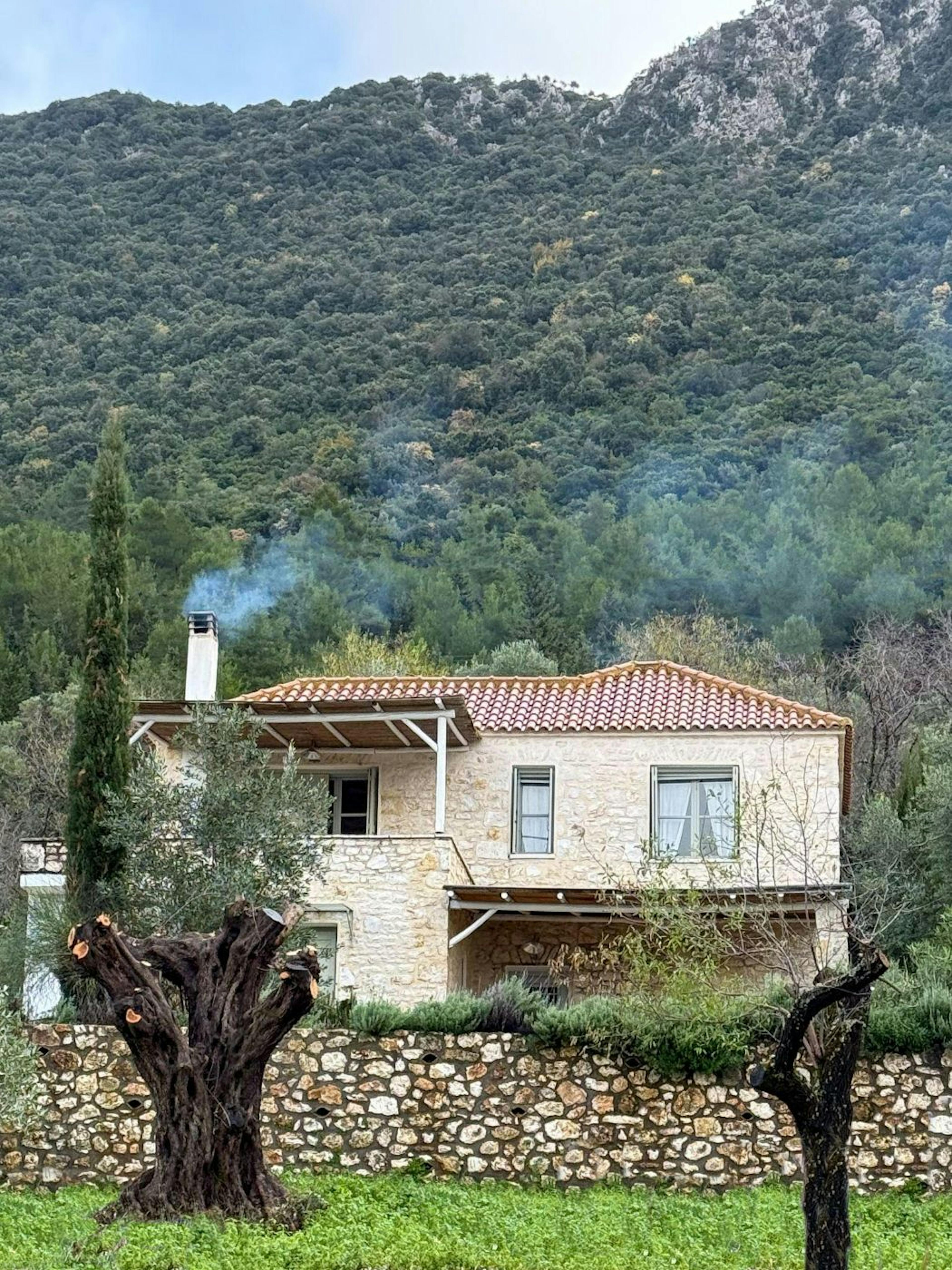 One of the houses in Episkopi Village, with its wood-burning fireplace and rustic charm, beautifully showcases the island's traditional architectural style.