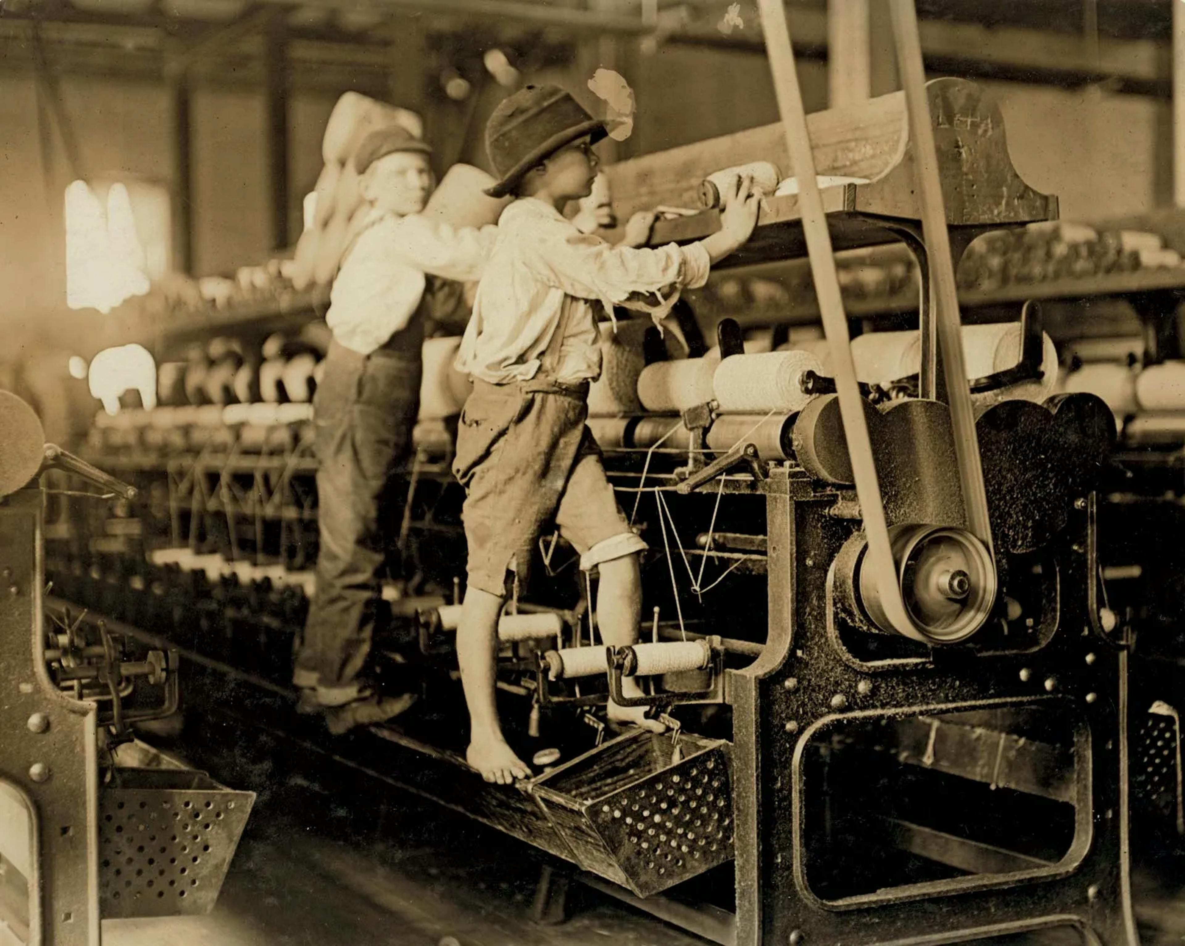 Young boys working in a thread-spinning mill, Macon, Georgia, 1909. Child labor was widespread after the Industrial Revolution.