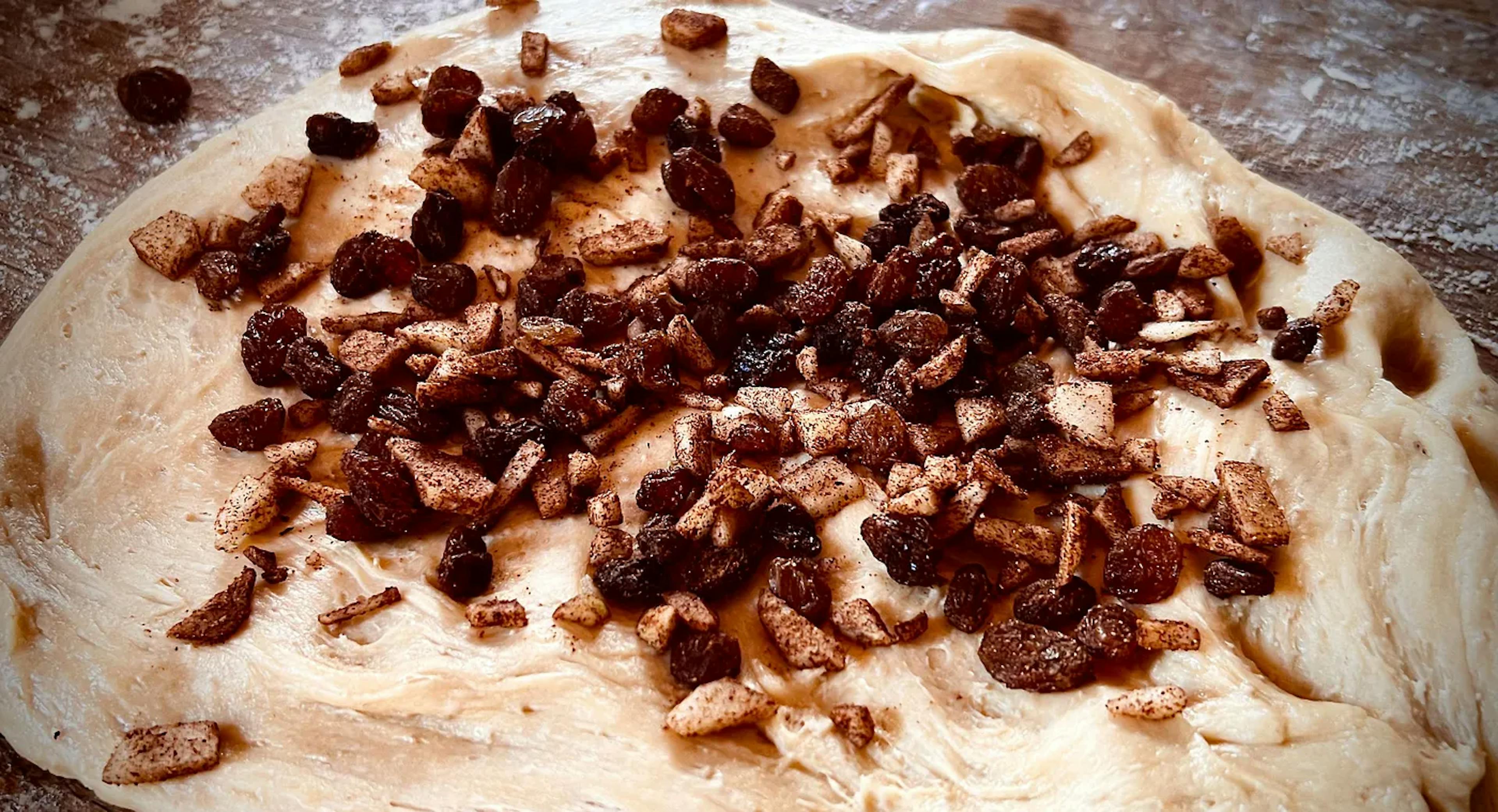 Hot cross bun dough and dried fruit in the making (photo by author)