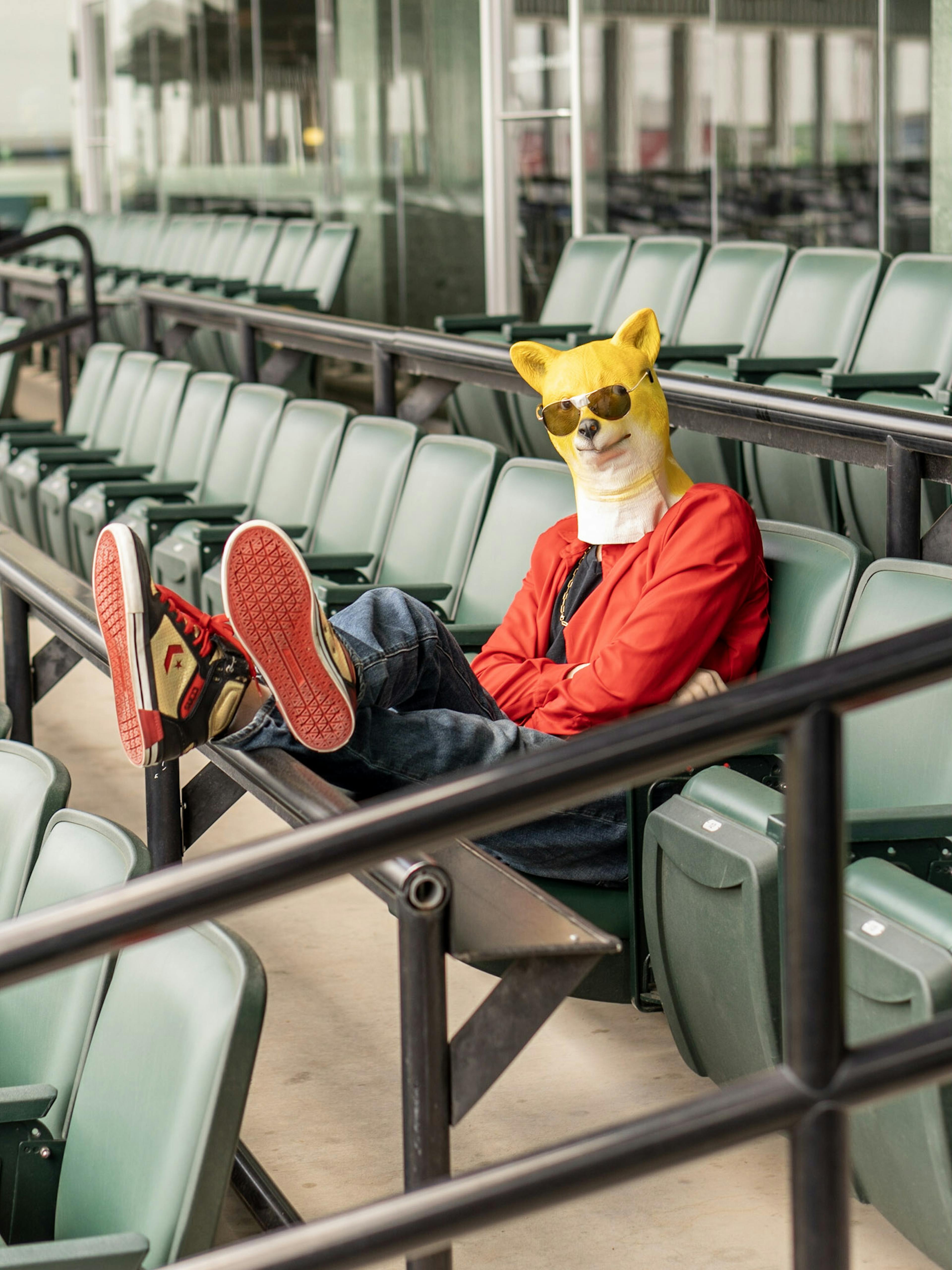 Rito Rhymes posted on the bleachers with a doge mask on