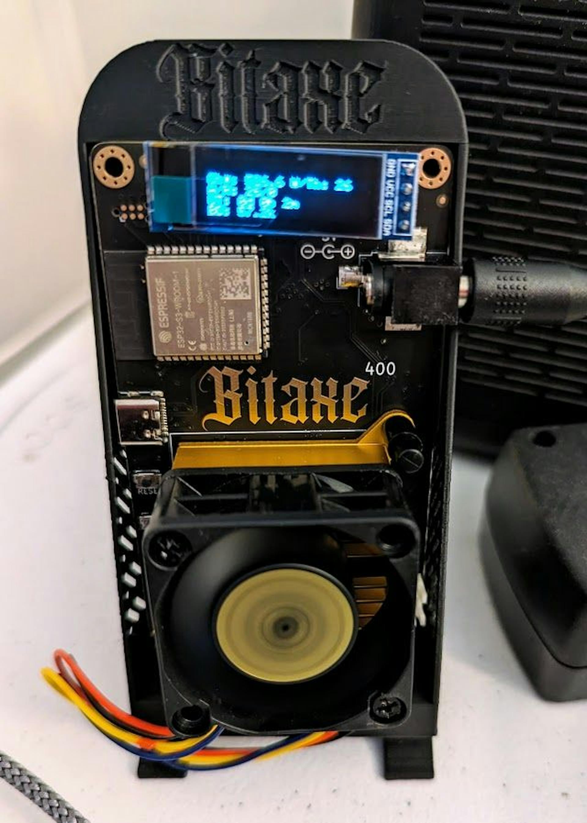 A Bitaxe Supra delivering 700 GH on the Author's Desktop