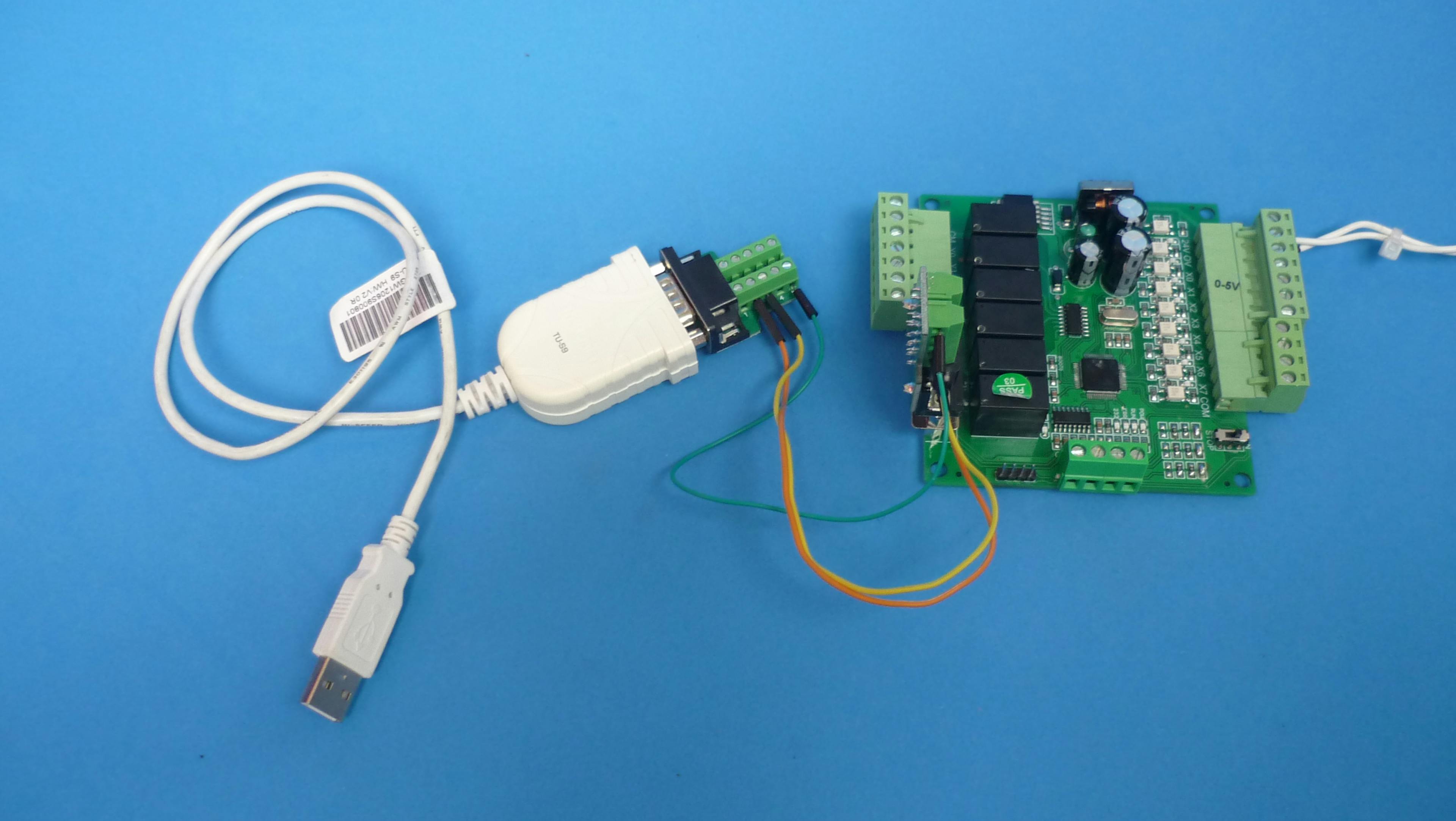 USB to RS232 converter and connectors used for communication check between PC and board