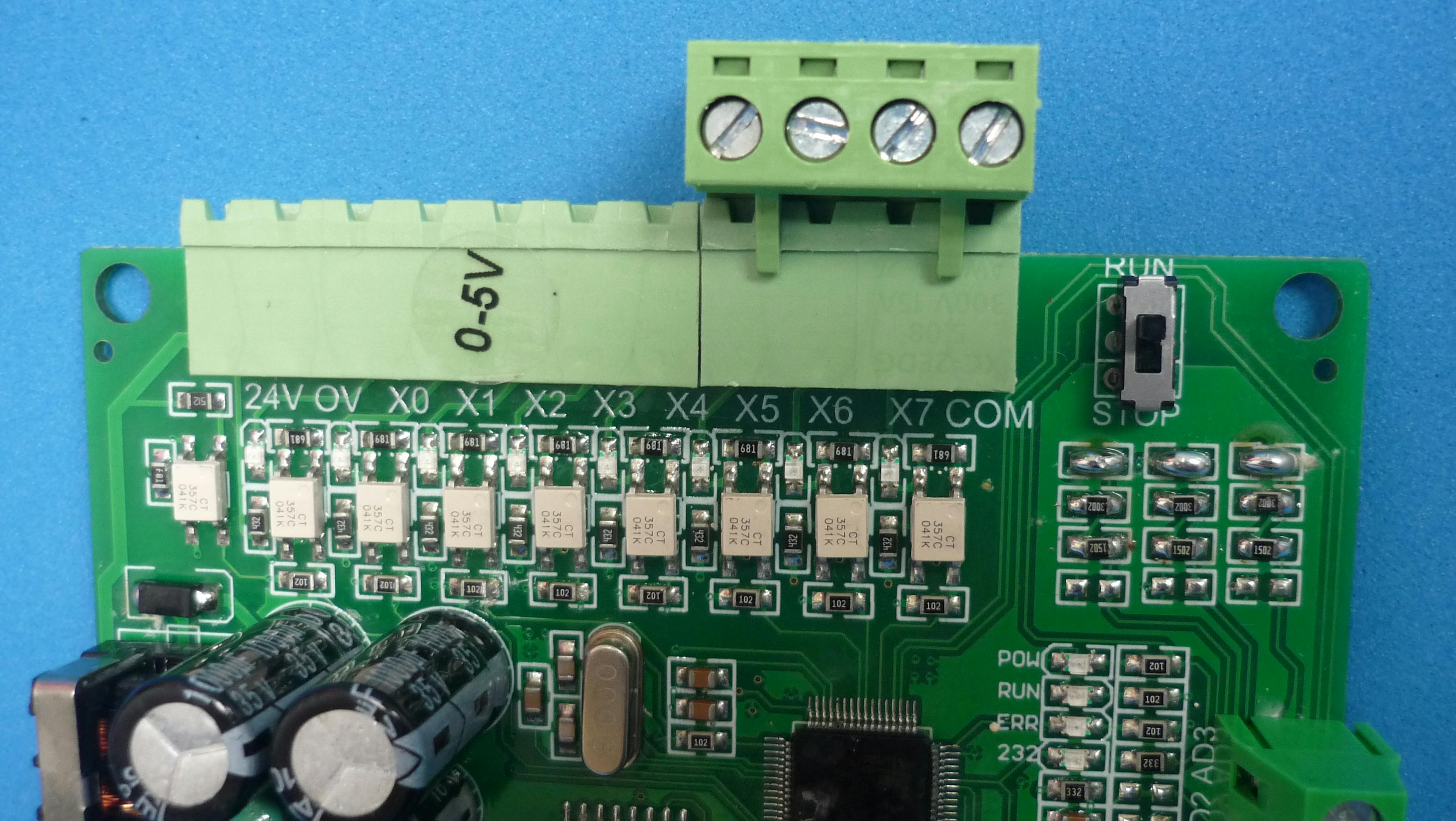 Microcontroller I/O pins connected to LED indicators and switch identified