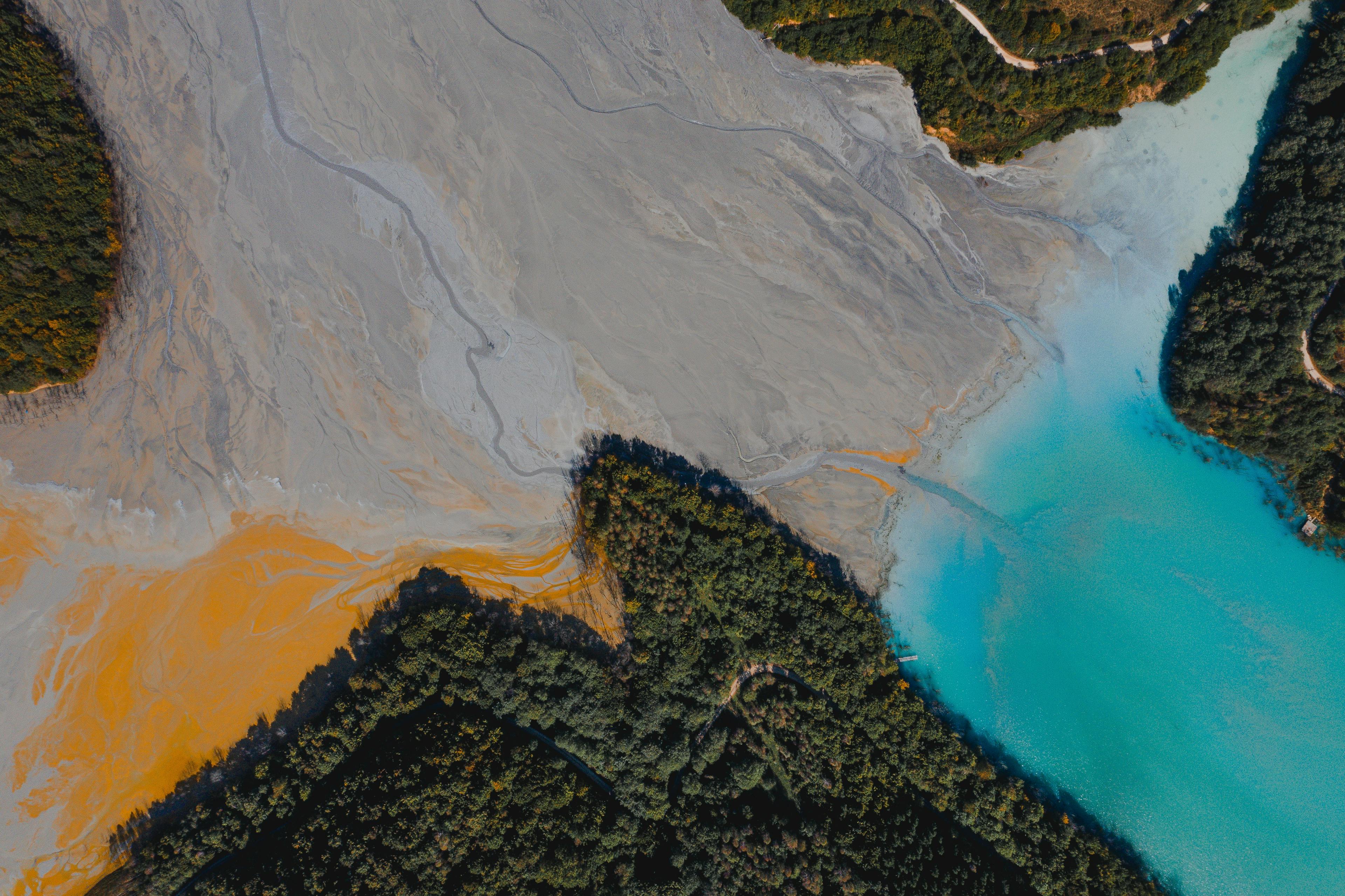 This lake near a mine in Romania is… not supposed to be this colorful. (Jaanus Jagomägi, Unsplash)