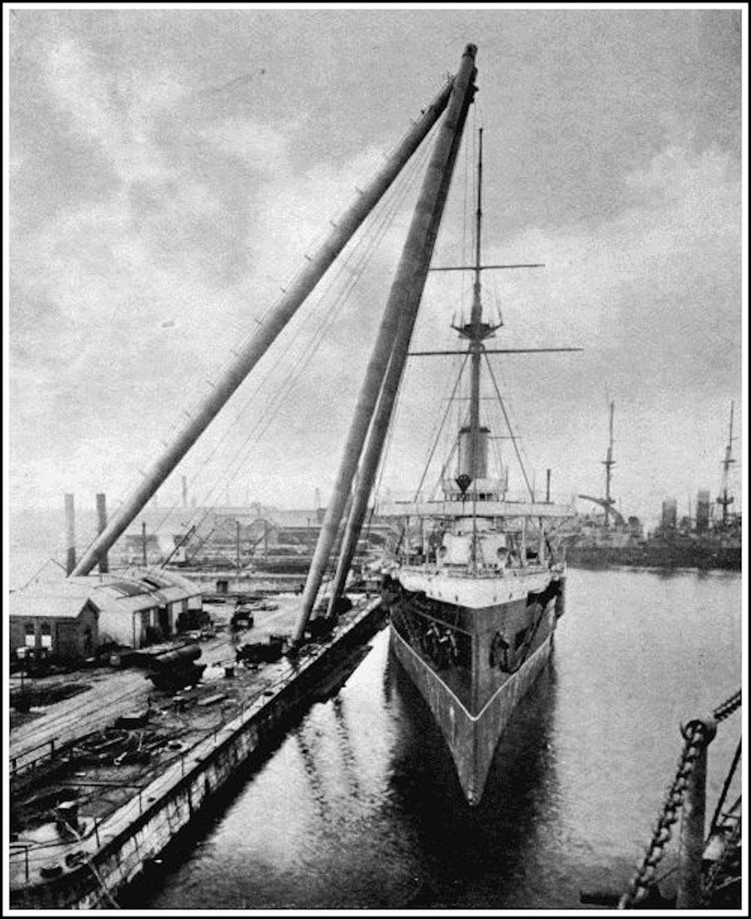 A gigantic sheer-legs used for lowering boilers, big guns, turrets, etc., into men-of-war. The legs rise to a height of 140 feet, and will handle weights up to 150 tons.