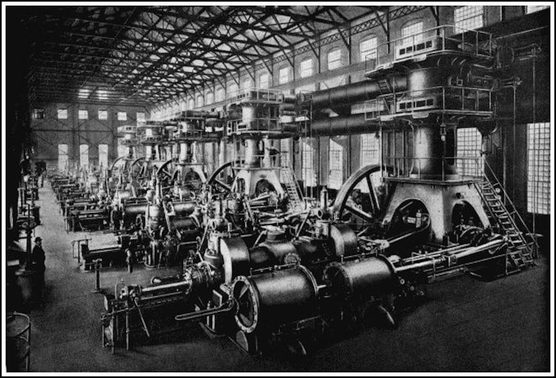 GIGANTIC GAS ENGINES
Five of sixteen 2,000 h.p. Körting Gas Engines built by the De la Vergne Company of New York City for blowing the blast furnaces of the Lackawanna Steel Company. The gas-engine plant at these works is the largest in the world. Notice the man to the left.