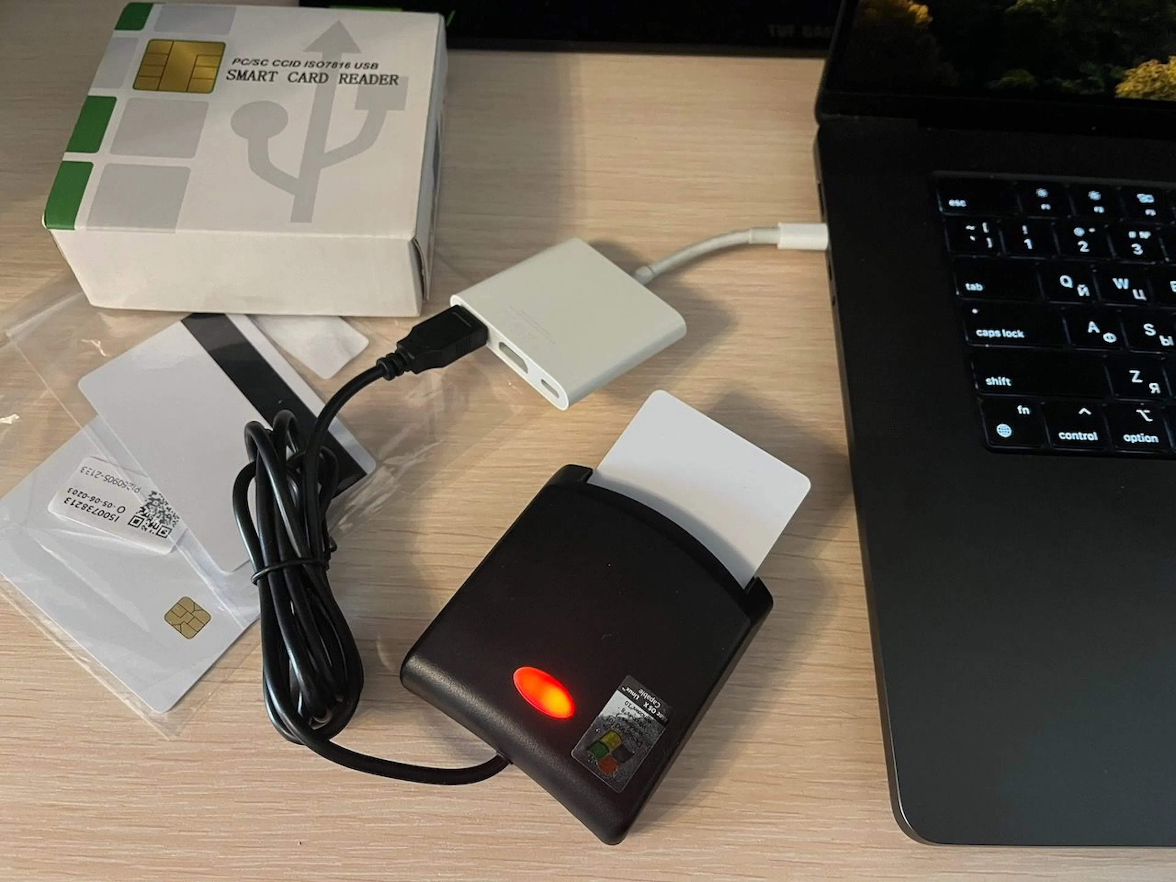 Fig. 2 - The bench: a $10 reader, a dev card, and nothing else.